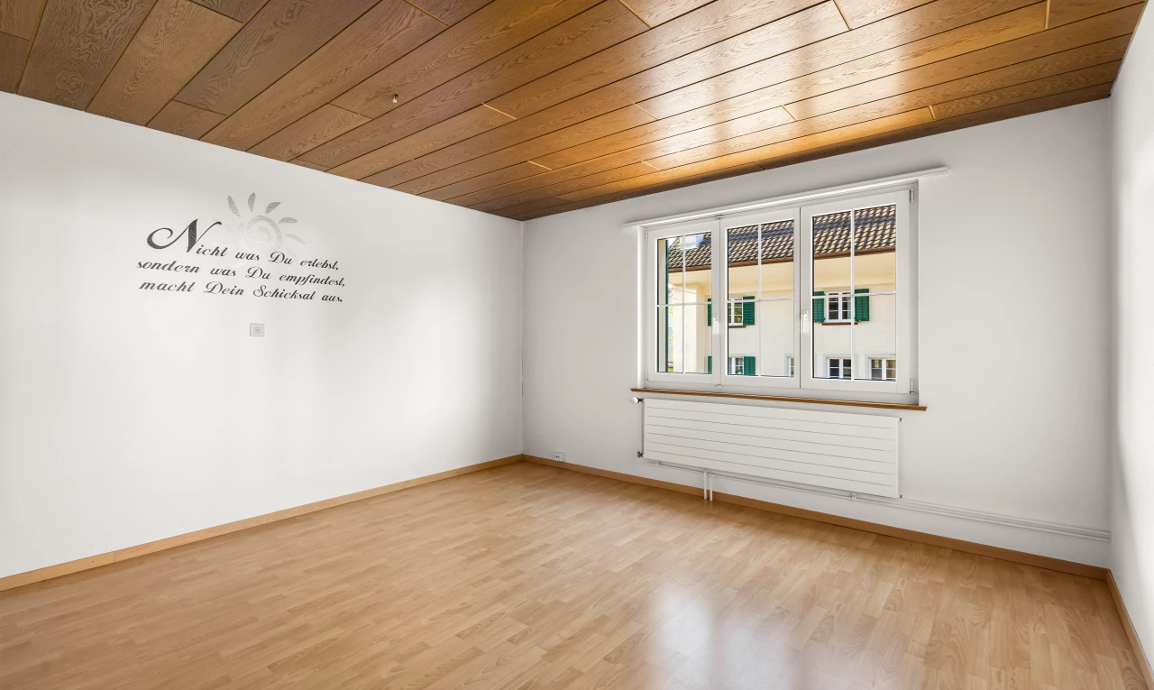 spare room featuring radiator heating unit, wooden ceiling, and light hardwood / wood-style flooring