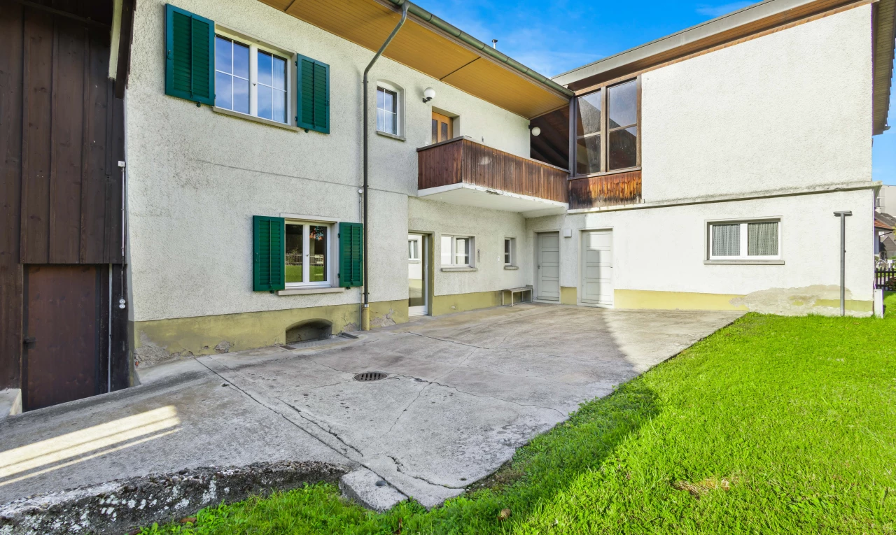 exterior space with a lawn and a patio