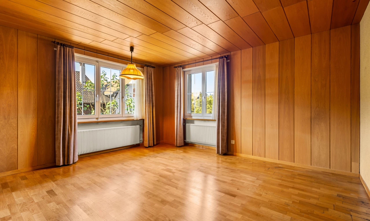 spare room featuring radiator, light hardwood / wood-style floors, and wood ceiling