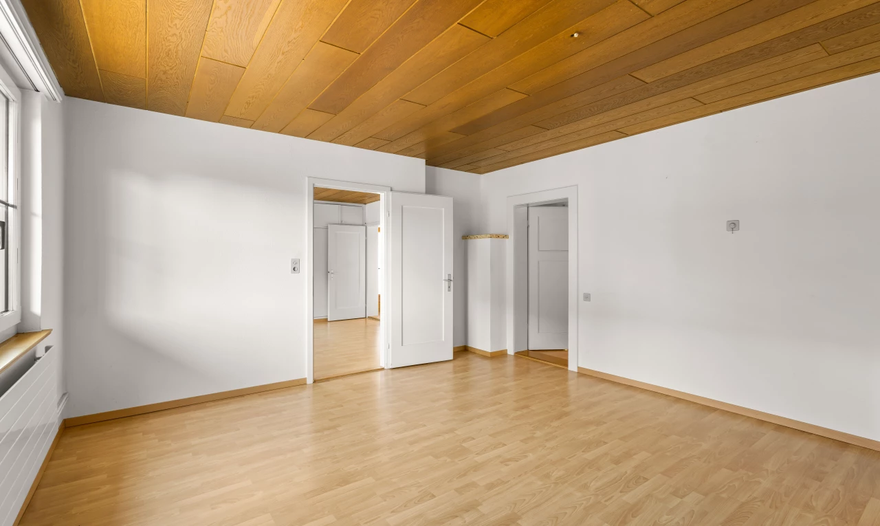 spare room featuring light wood-type flooring and wood ceiling