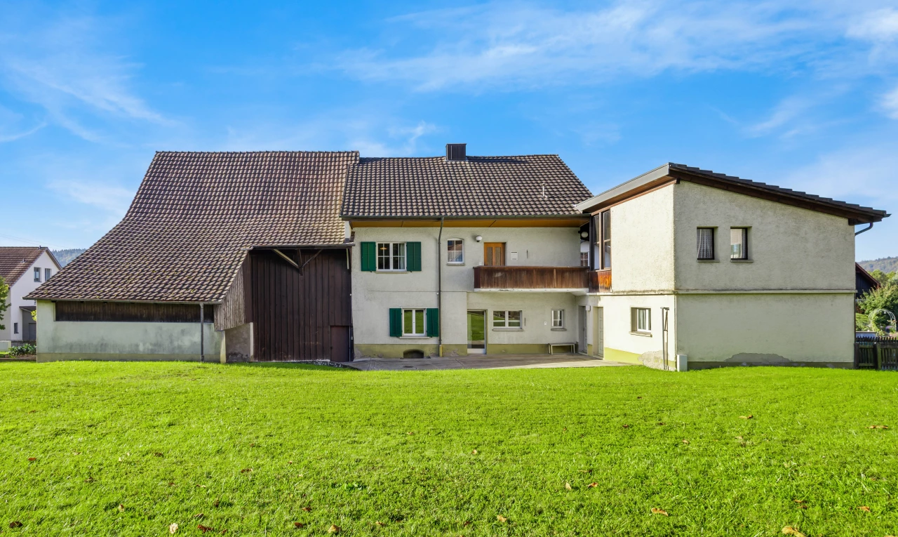 view of home featuring a yard and a patio