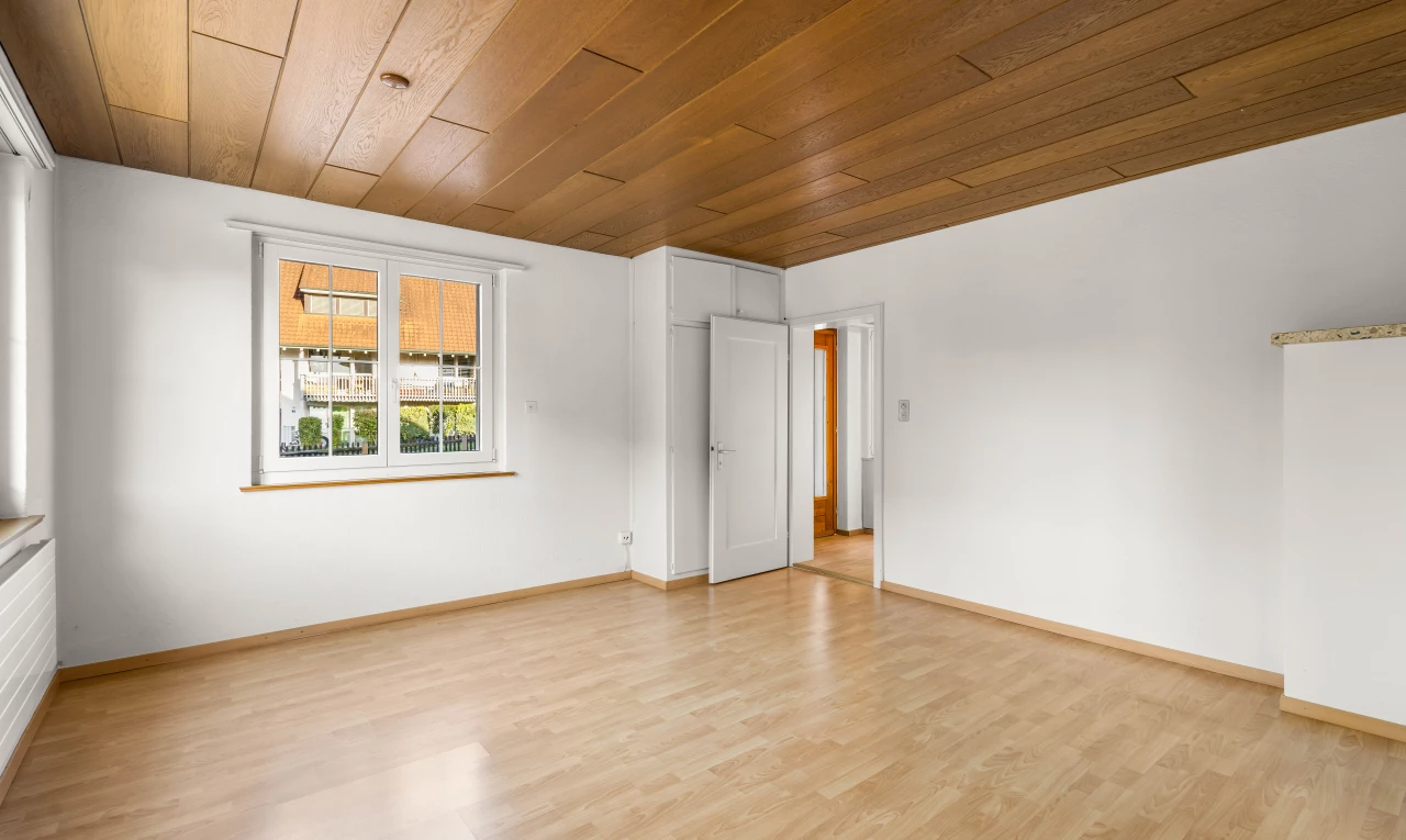empty room with light hardwood / wood-style floors and wood ceiling