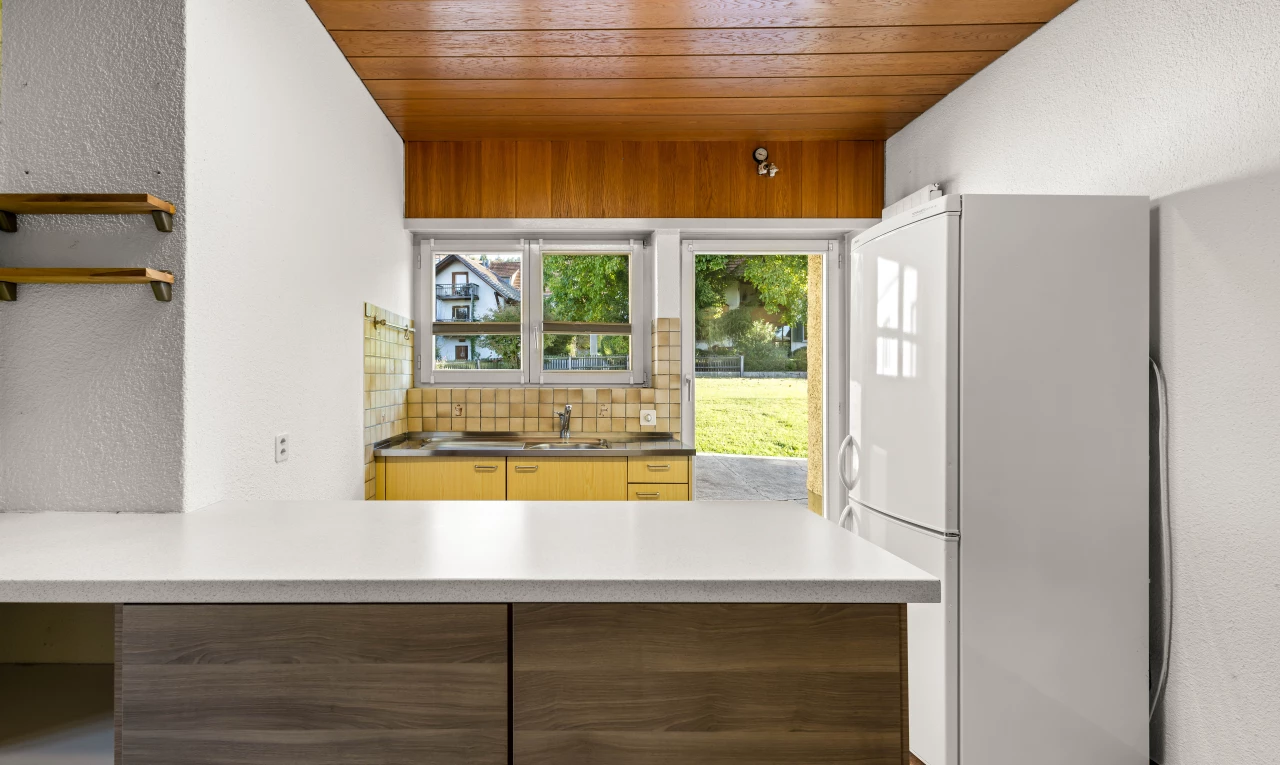 kitchen with tasteful backsplash, white refrigerator, and wooden ceiling