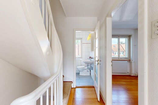 halle / korridor mit wood finish floor, holzfußboden, kühler, treppen, und inside property