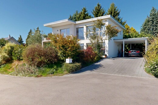 außenansicht mit carport angeschlossen, day time, auffahrt, property visible, und stuckverkleidung