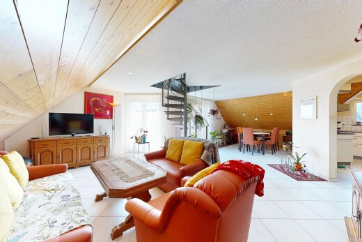 living area with arched walkways and lofted ceiling