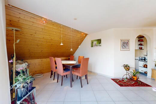 dining area with lofted ceiling and arched walkways