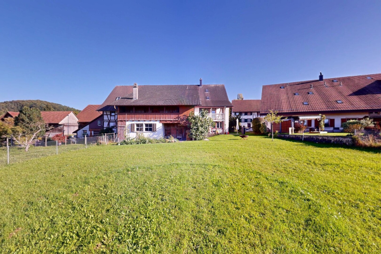 view of property featuring a lawn and a chimney