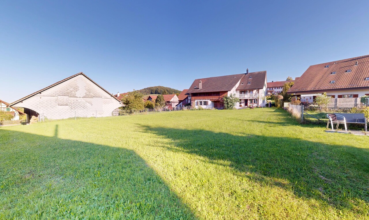garden featuring a lawn and a residential view