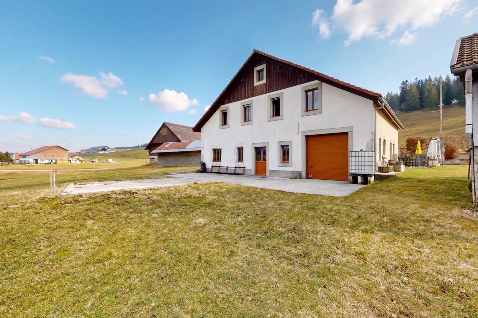 view of home featuring a yard and driveway