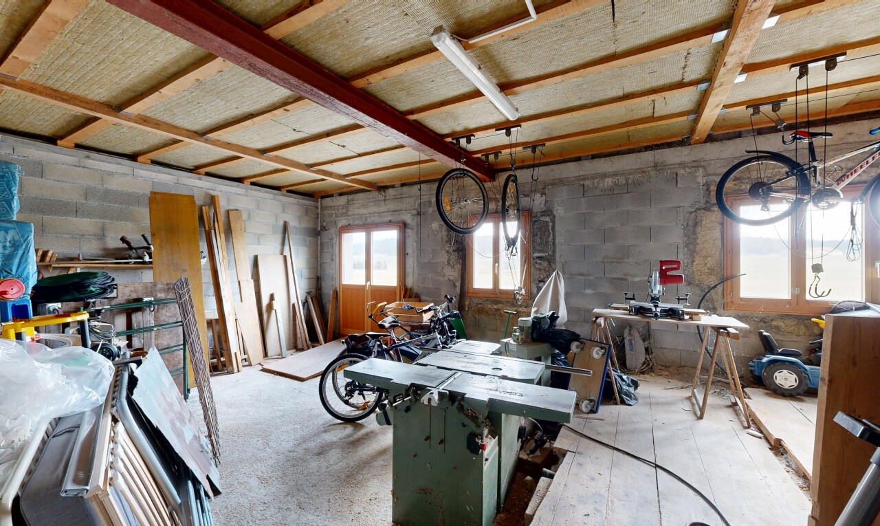 dining area with concrete block wall