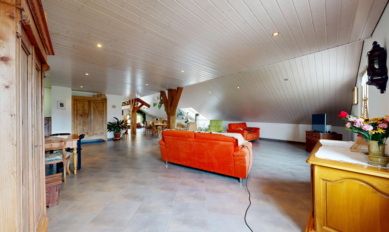 living area with recessed lighting and a vaulted wood ceiling