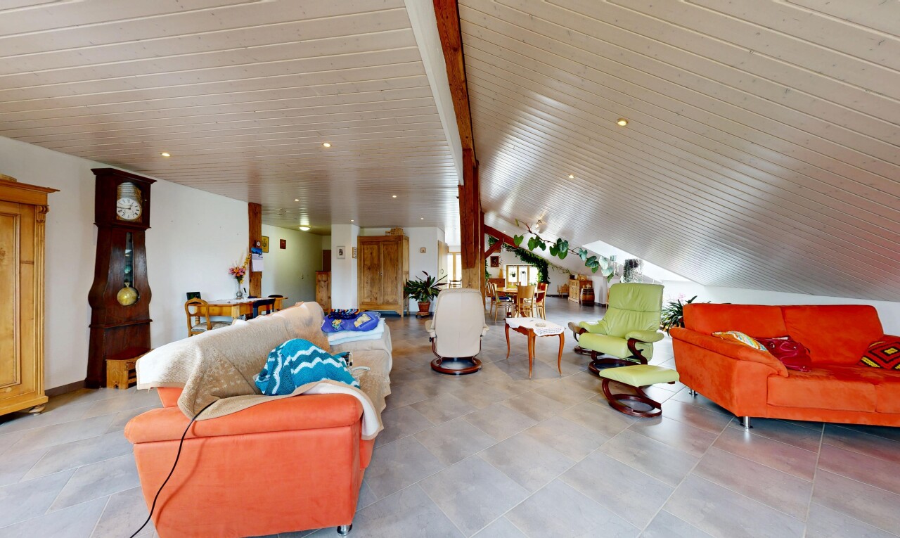 living area featuring recessed lighting and vaulted ceiling with beams