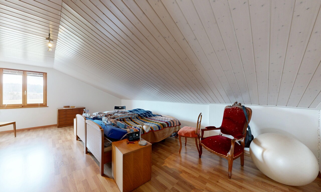 room / bedroom featuring light wood-style flooring and lofted ceiling