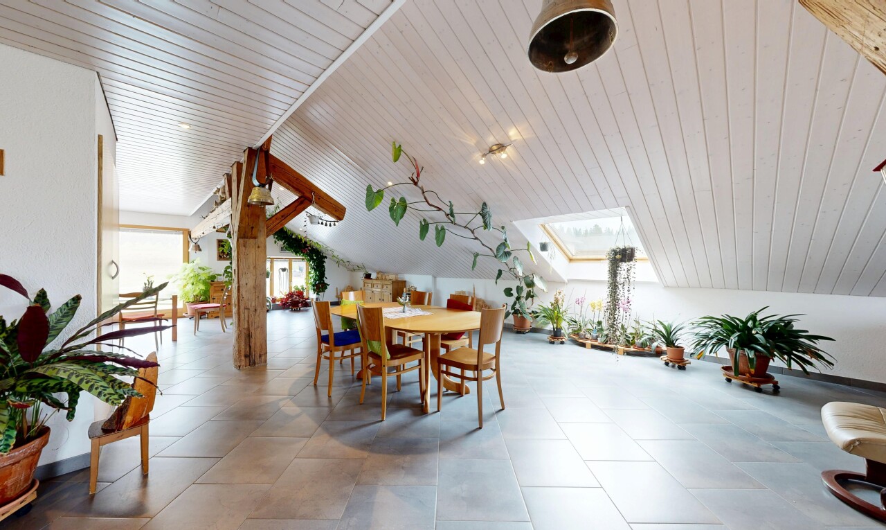 dining room featuring a vaulted wooden ceiling and a skylight