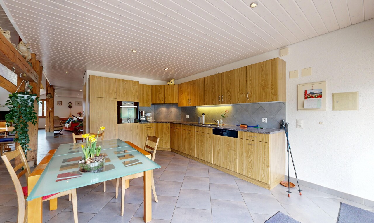 kitchen featuring stainless steel oven, backsplash, modern cabinets, and light tile patterned floors