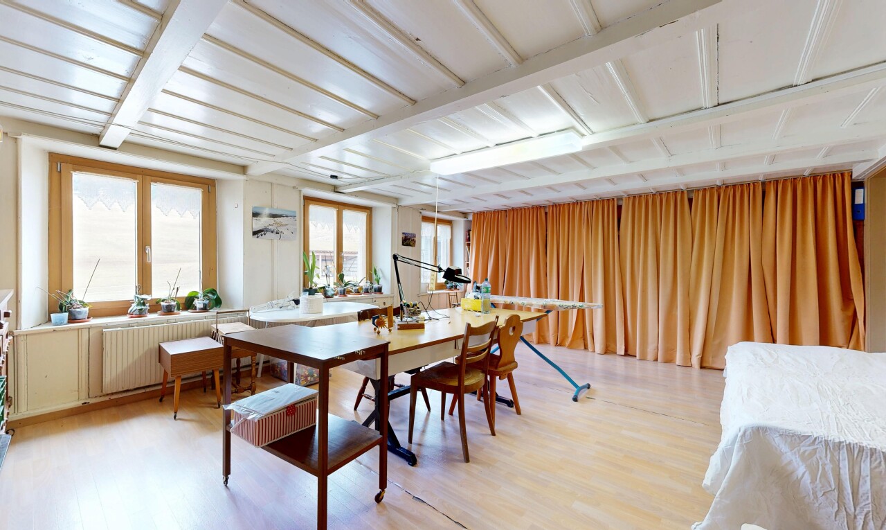 dining space featuring light wood finished floors and radiator heating unit