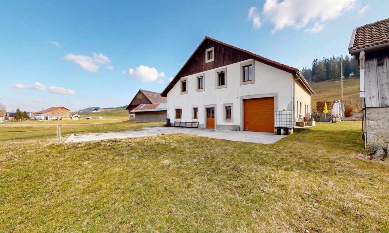 view of home featuring a yard and driveway
