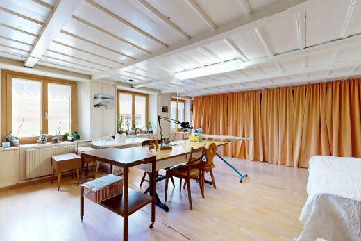 dining space featuring light wood finished floors and radiator heating unit