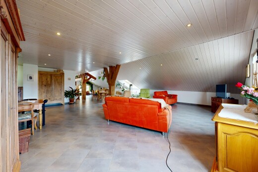 living area with recessed lighting and a vaulted wood ceiling