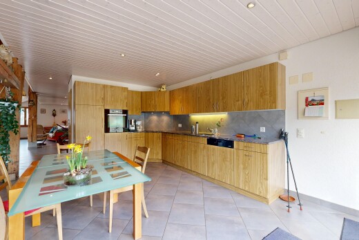 kitchen featuring stainless steel oven, backsplash, modern cabinets, and light tile patterned floors