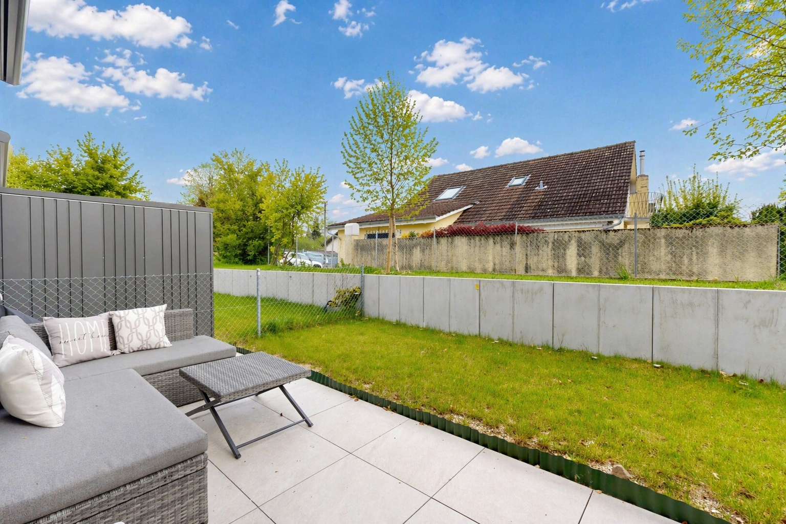 terrace with a patio area, a fenced backyard, and outdoor furniture