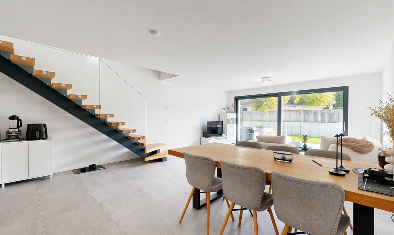 dining space featuring stairs
