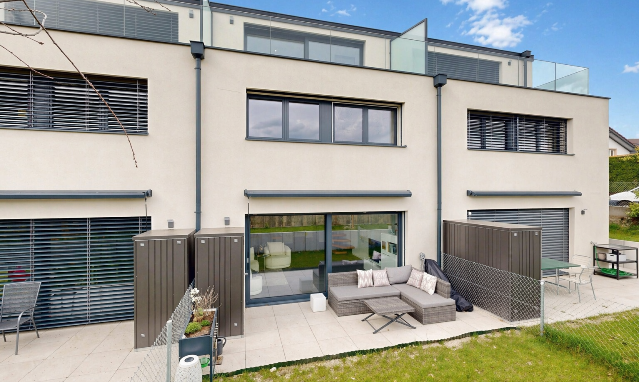 view of property featuring stucco siding, a patio, and an outdoor living space