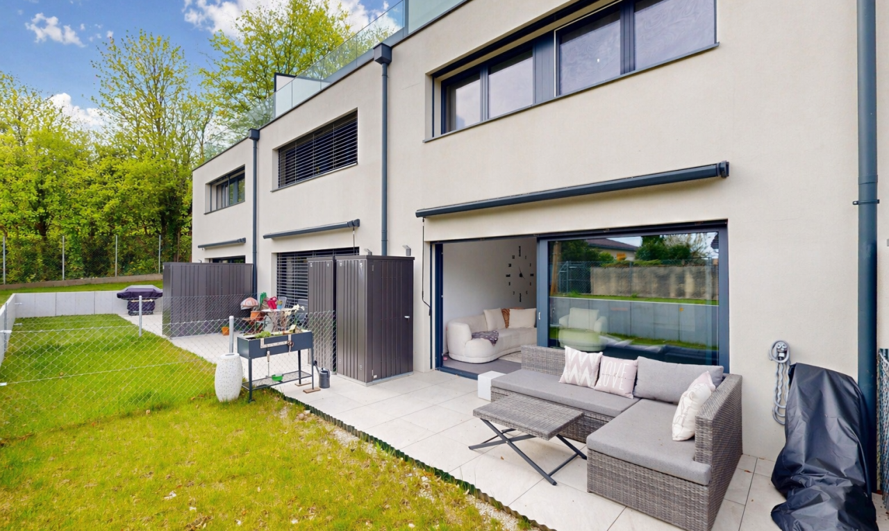 outdoor house with stucco siding, a patio, and outdoor lounge area