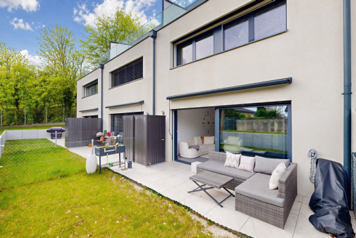 outdoor house with stucco siding, a patio, and outdoor lounge area