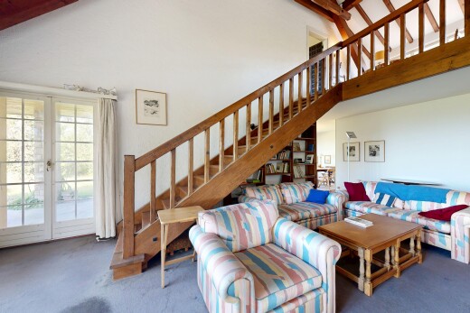 living room featuring french doors, access to exterior, and vaulted ceiling