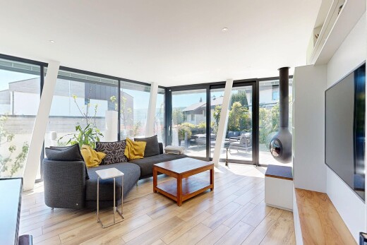 living area with light wood-style floors and floor to ceiling windows