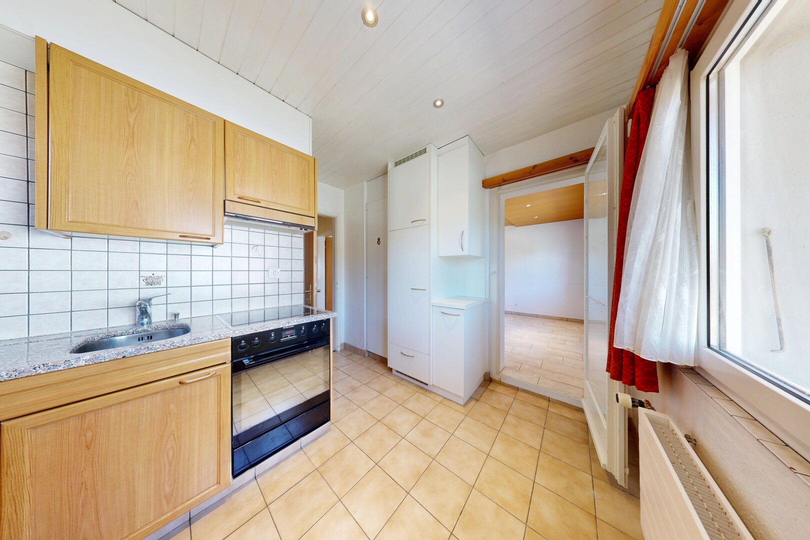 küche mit ofen, light countertops, light floor, kühler, und inside property