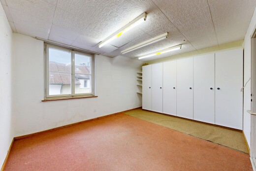 carpeted spare room with baseboards