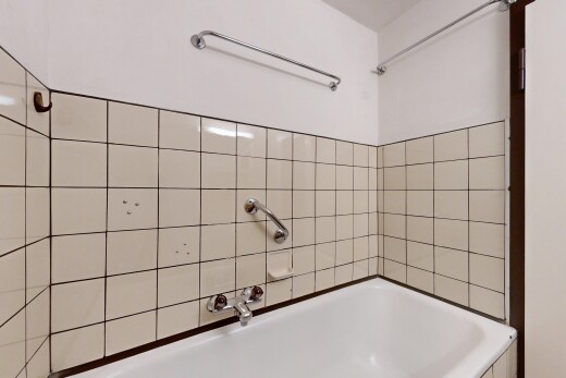 bathroom featuring a tub and a shower