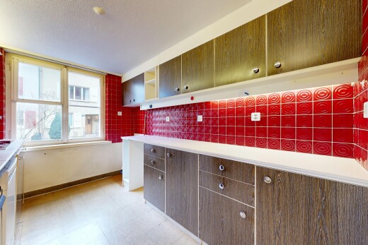 kitchen with light flooring, light countertops, tasteful backsplash, open shelves, and dark wood finish cabinets