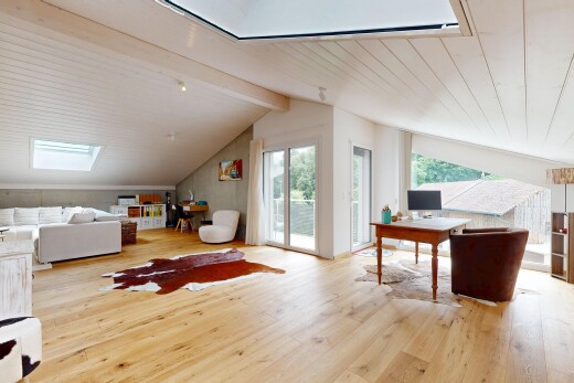 living room featuring light wood finished floors, a wood ceiling with exposed beams, a skylight, and a desk