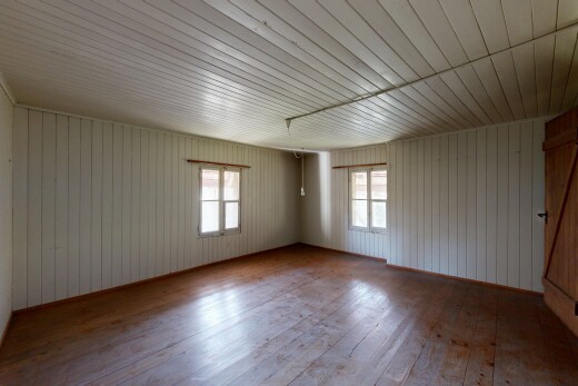 spare room with hardwood / wood-style flooring and plenty of natural light