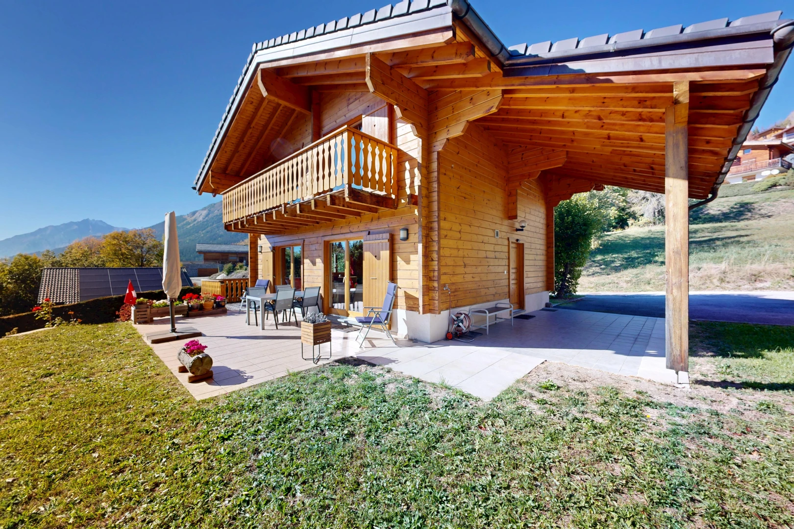 view of home featuring a balcony and a patio