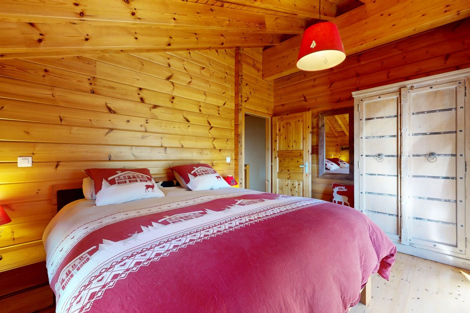 room with wooden ceiling, wooden walls, light wood-type flooring, and vaulted ceiling with beams