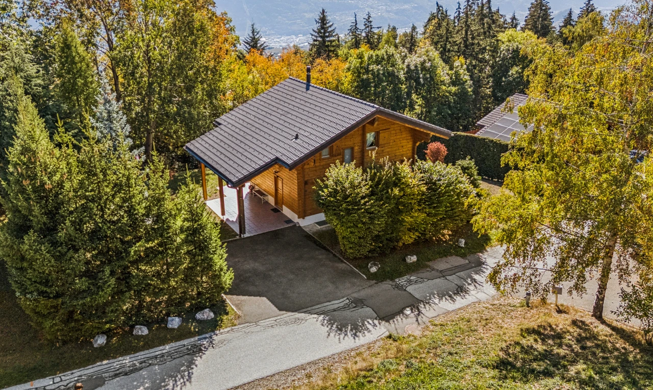 view of property featuring asphalt driveway