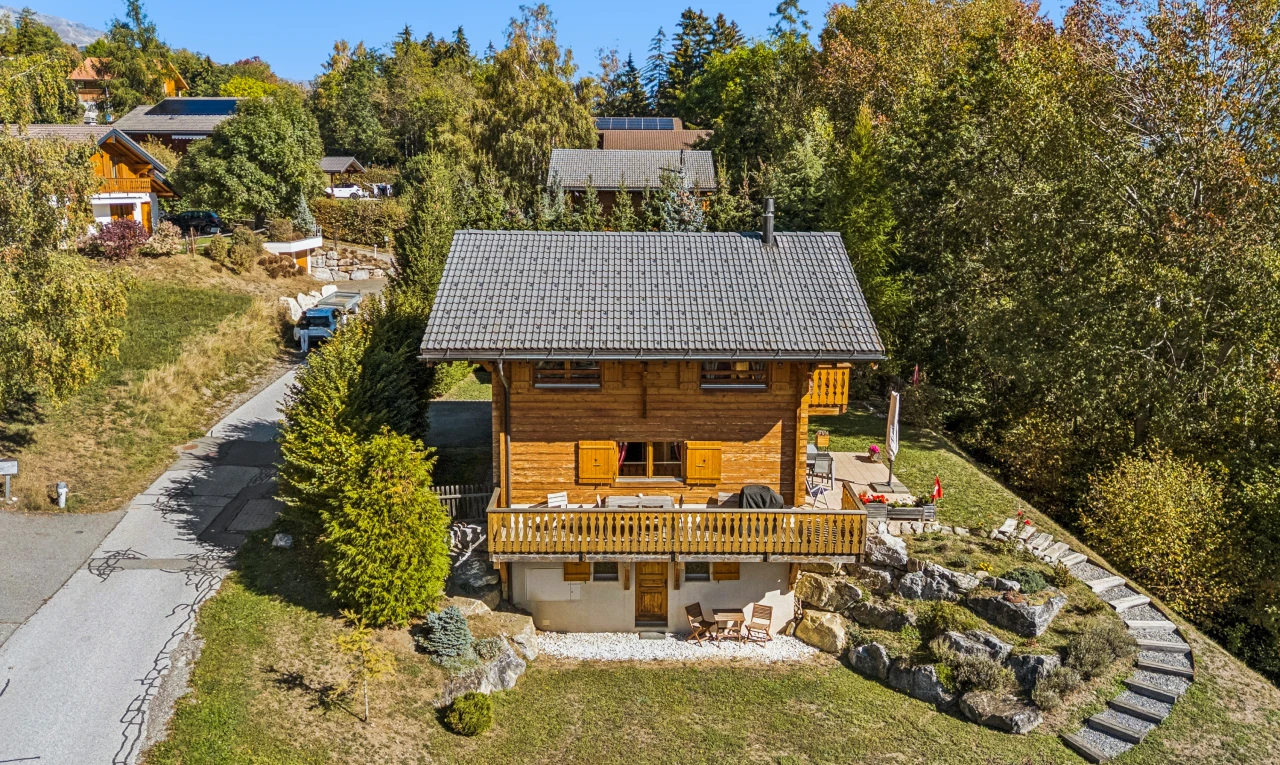 outdoor house with a yard and a patio area