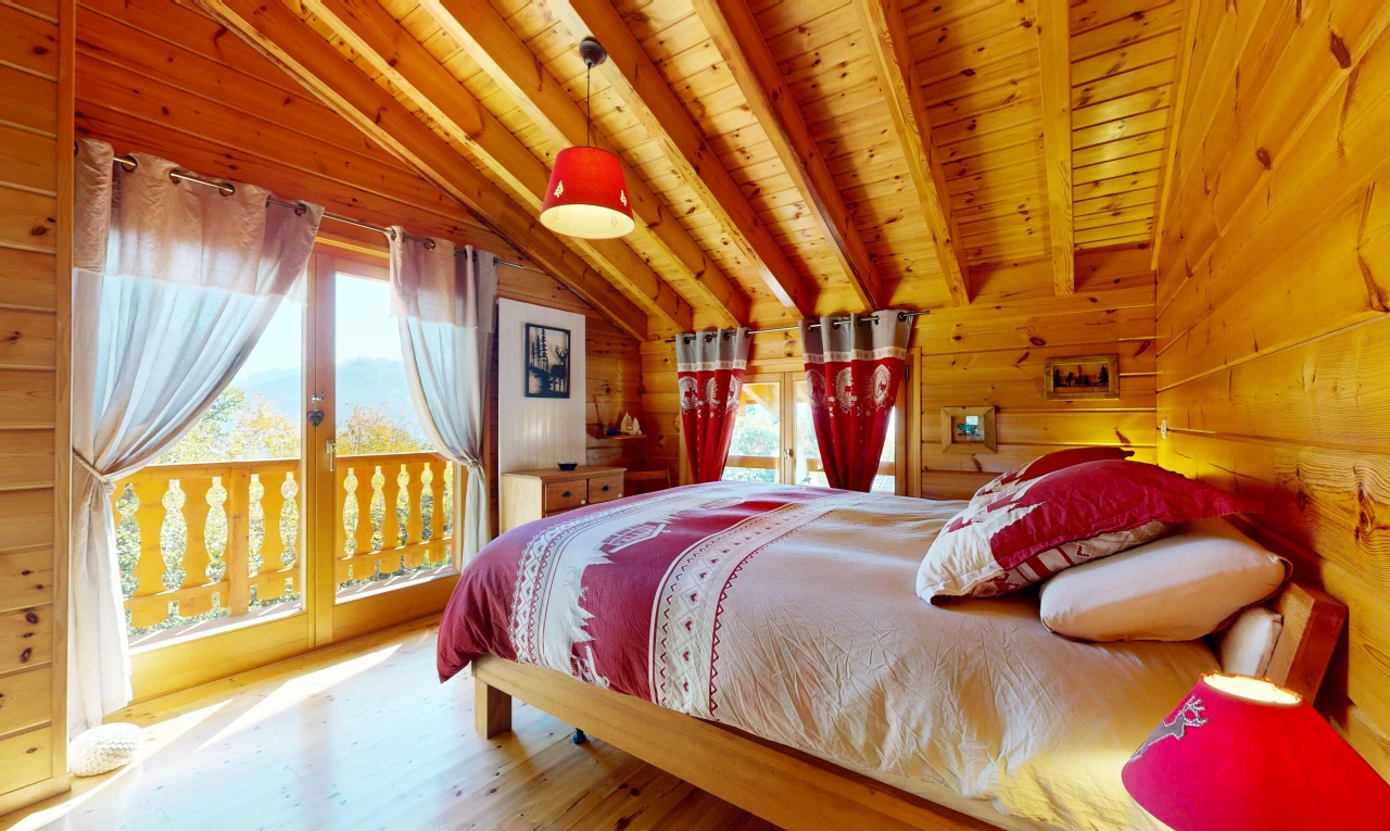 room / bedroom featuring vaulted ceiling with beams, wooden ceiling, access to outside, wood walls, and decorative light fixtures