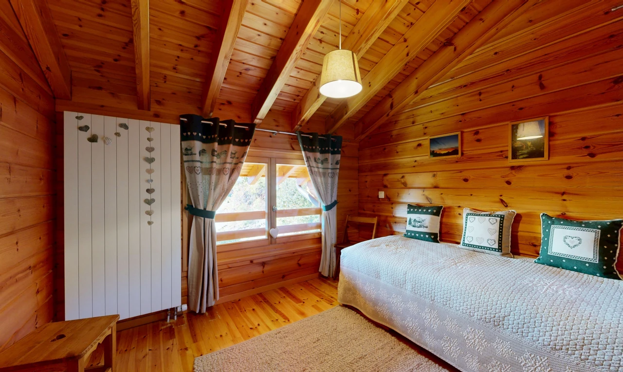 room featuring vaulted ceiling with beams, wood ceiling, light wood-style flooring, and wood walls
