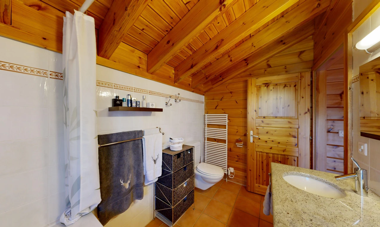 full bath featuring a towel warmer, a shower with shower curtain, radiator heating unit, vanity, and wooden ceiling