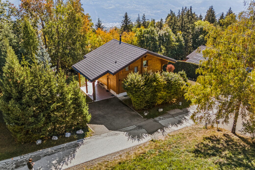 view of property featuring asphalt driveway