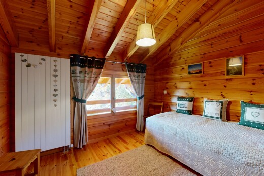 room featuring vaulted ceiling with beams, wood ceiling, light wood-style flooring, and wood walls