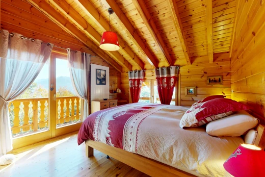 room / bedroom featuring vaulted ceiling with beams, wooden ceiling, access to outside, wood walls, and decorative light fixtures