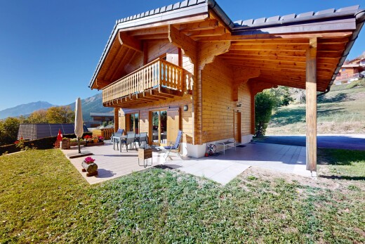 view of home featuring a balcony and a patio