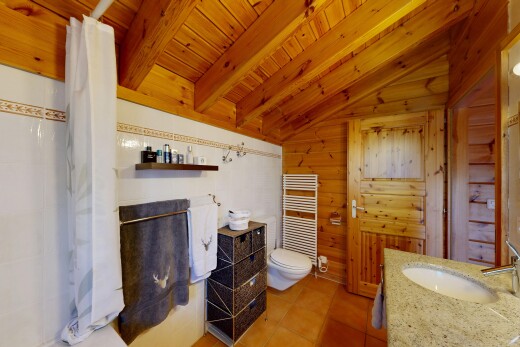 full bath featuring a towel warmer, a shower with shower curtain, radiator heating unit, vanity, and wooden ceiling